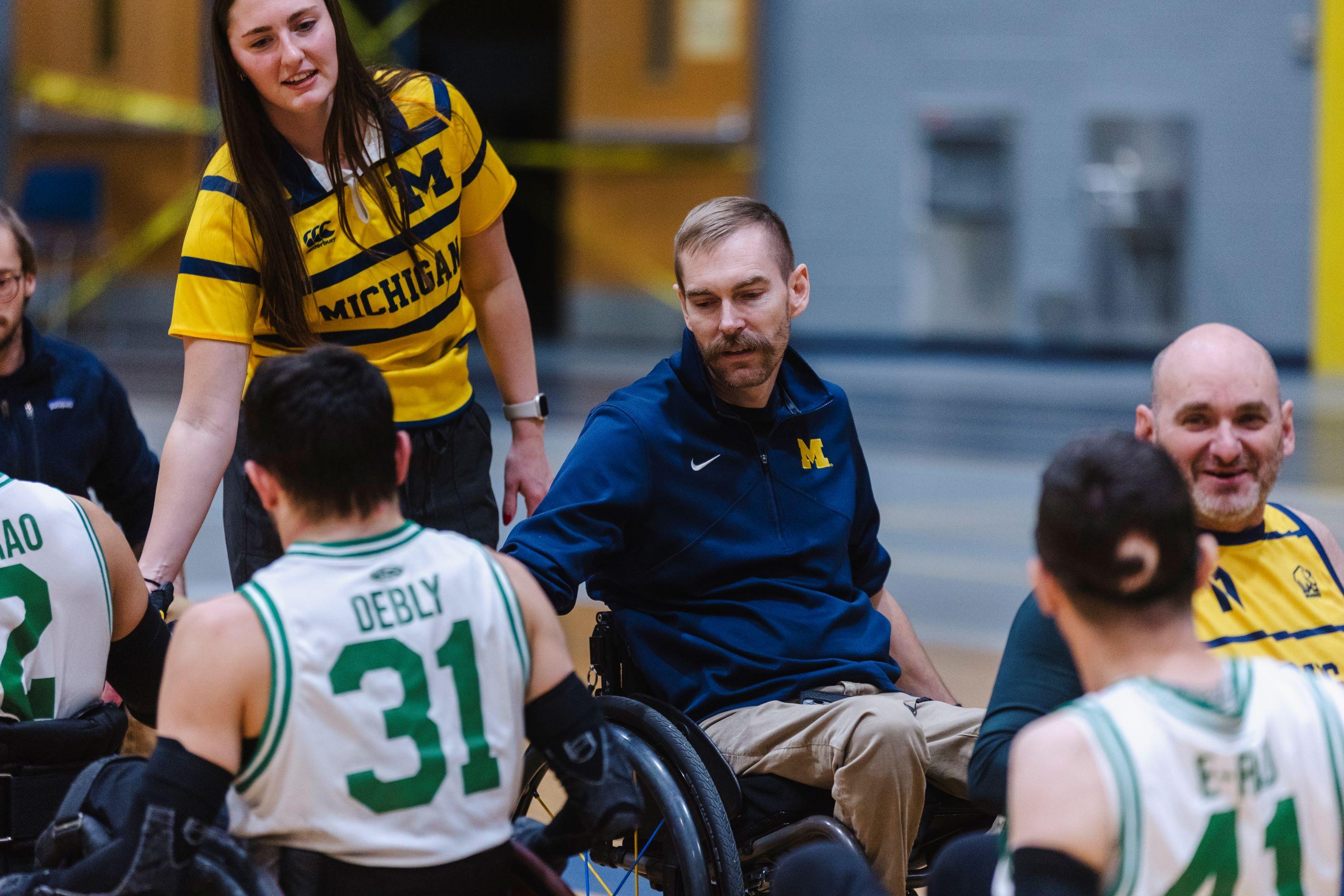 2024 Coupie Classic UM Wheelchair Rugby. Athletes giving high fives to the other team after a game.